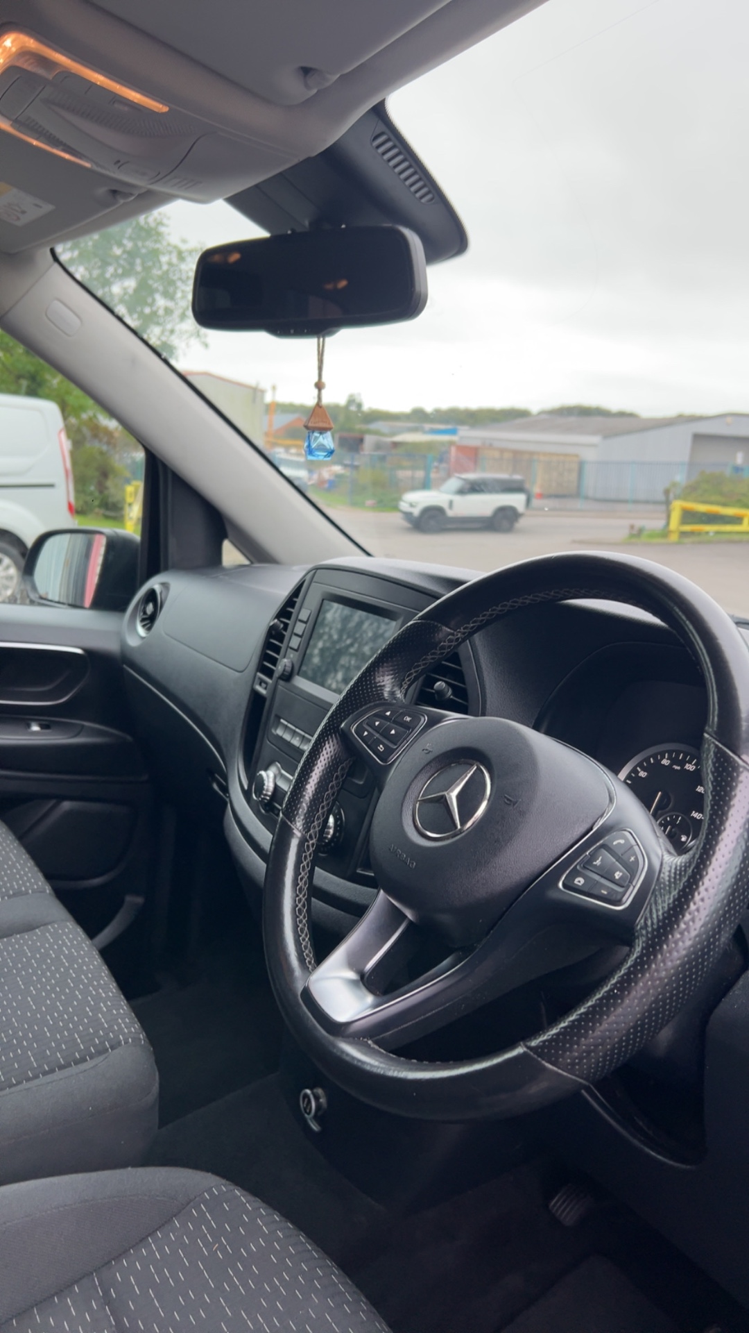 Clean dashboard and steering wheel inside the Mercedes Vito