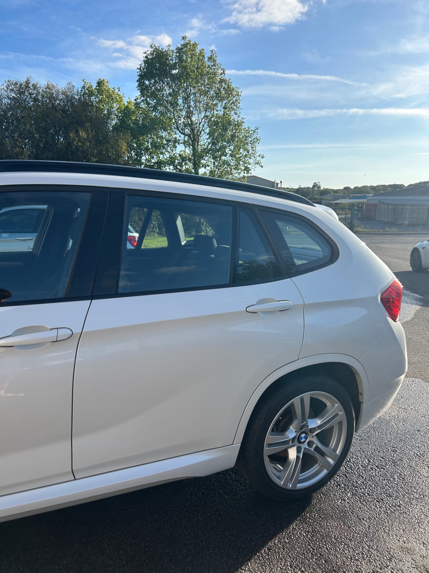Clean rear wheel and polished side panels on the BMW