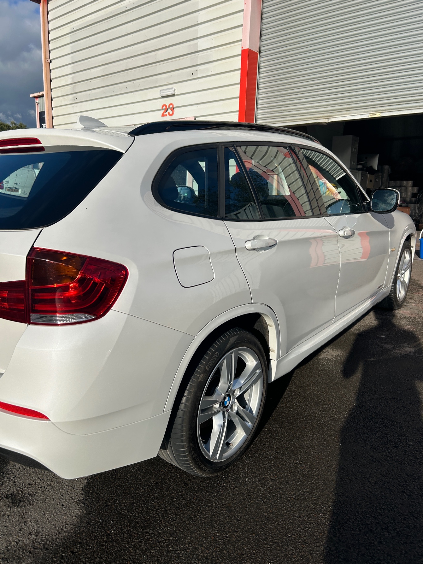 Rear side of the freshly detailed white BMW